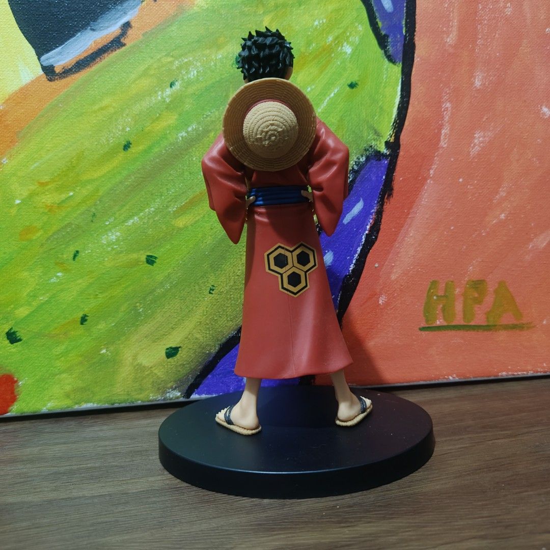 One Piece Monkey D. Luffy Kimono Figure (Category: Figurines & Statues) located in Quezon City. Submitted by patric1218 (Listing ID 1444844323, Image 2). Description: - Luffy figure in a striking red kimono - Iconic straw hat included - Comes with a sleek black display base - Stands approximately 6-7 inches tall - Features clear details and good paint application - A must-have for any One Piece fan's collection.