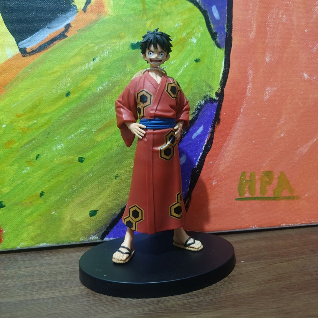 One Piece Monkey D. Luffy Kimono Figure (Category: Figurines & Statues) located in Quezon City. Submitted by patric1218 (Listing ID 1444844323, Image 1). Description: - Luffy figure in a striking red kimono - Iconic straw hat included - Comes with a sleek black display base - Stands approximately 6-7 inches tall - Features clear details and good paint application - A must-have for any One Piece fan's collection.