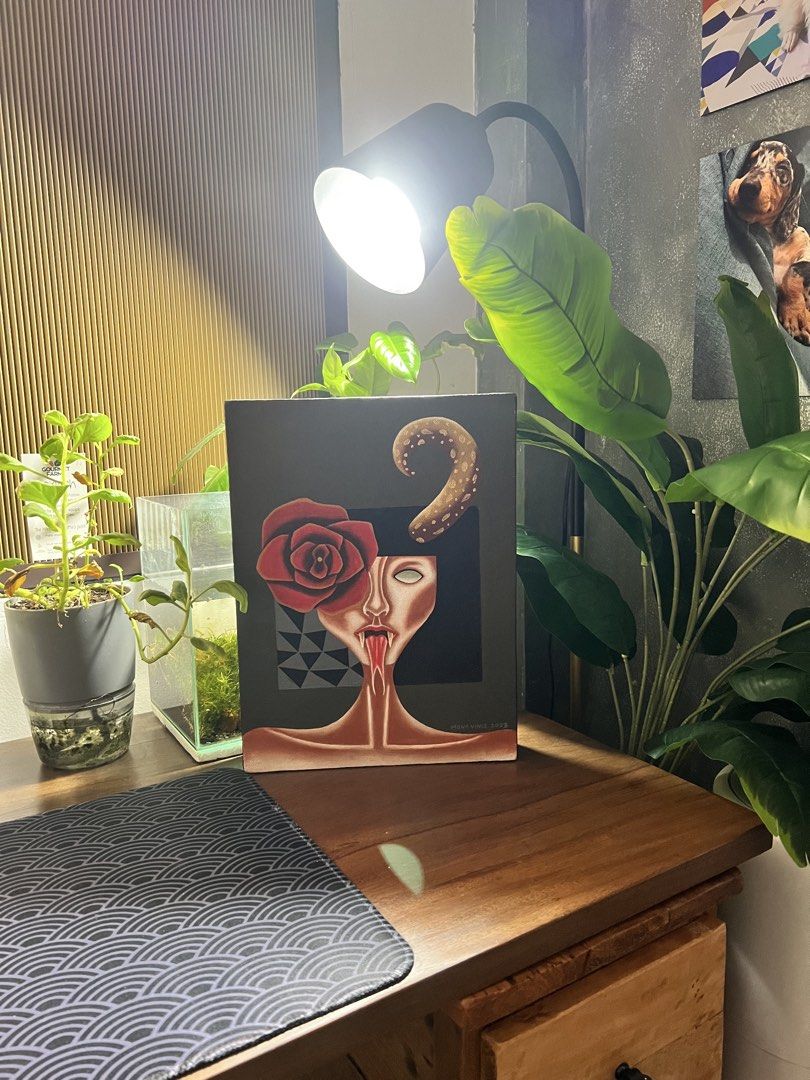 Original Acrylic Painting on Canvas (Category: Art & Prints) located in Quezon City. Submitted by sell4less123 (Listing ID 1444788957, Image 1). Description: - Sturday and fine clean finish ready to hang - Unique surrealist art print - Features a woman's face with a red rose and swirling tentacle - Geometric background pattern - Dark and intriguing aesthetic - Perfect statement piece for any room - Approximate size: 12x9 inches Strictly payment f