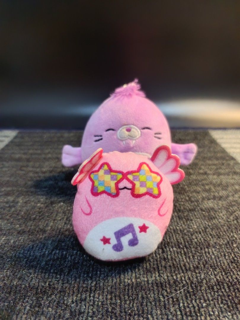 Original Squishmallows Archie Keychain Plush Toy (Category: Plushies & Soft Toys) located in Baguio. Submitted by 26_zerozero (Listing ID 1444837945, Image 3). Description: - Selling 2 original Squishmallows keychains. - Includes Archie (purple seal) and a pink owl. - Pink owl features star sunglasses and musical notes. - Both keychains have clips attached. - Perfect for decorating bags, backpacks, or purses. - Super soft and squishy texture..