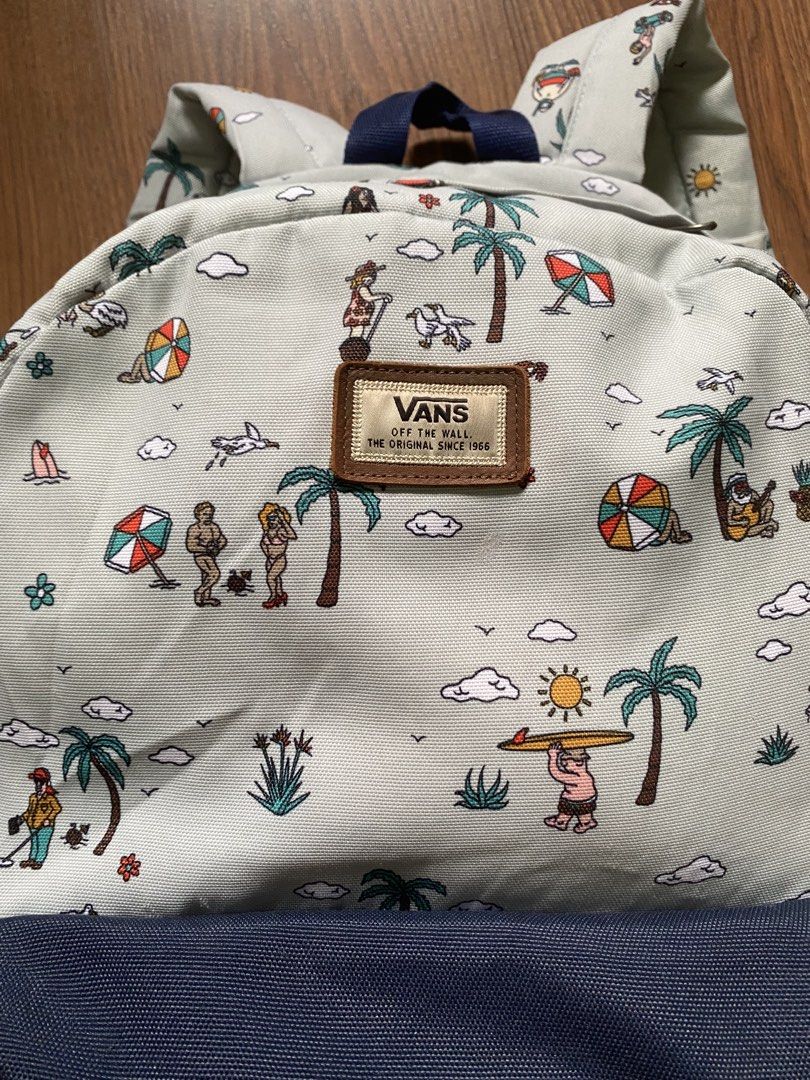 ORIGINAL Vans Backpack - Fun Beach Print (Category: Backpacks) located in Quezon City. Submitted by onlinegaragesale1 (Listing ID 1444760114, Image 3). Description: - Fun beach scene print - casual / travel backpack / school backpack - Navy blue front multi pocket - Vans logo on zippers (proof of authenticity) - Plenty of space inside - Perfect for school or everyday use - can send more photos upon request - cool, one of a kind design.