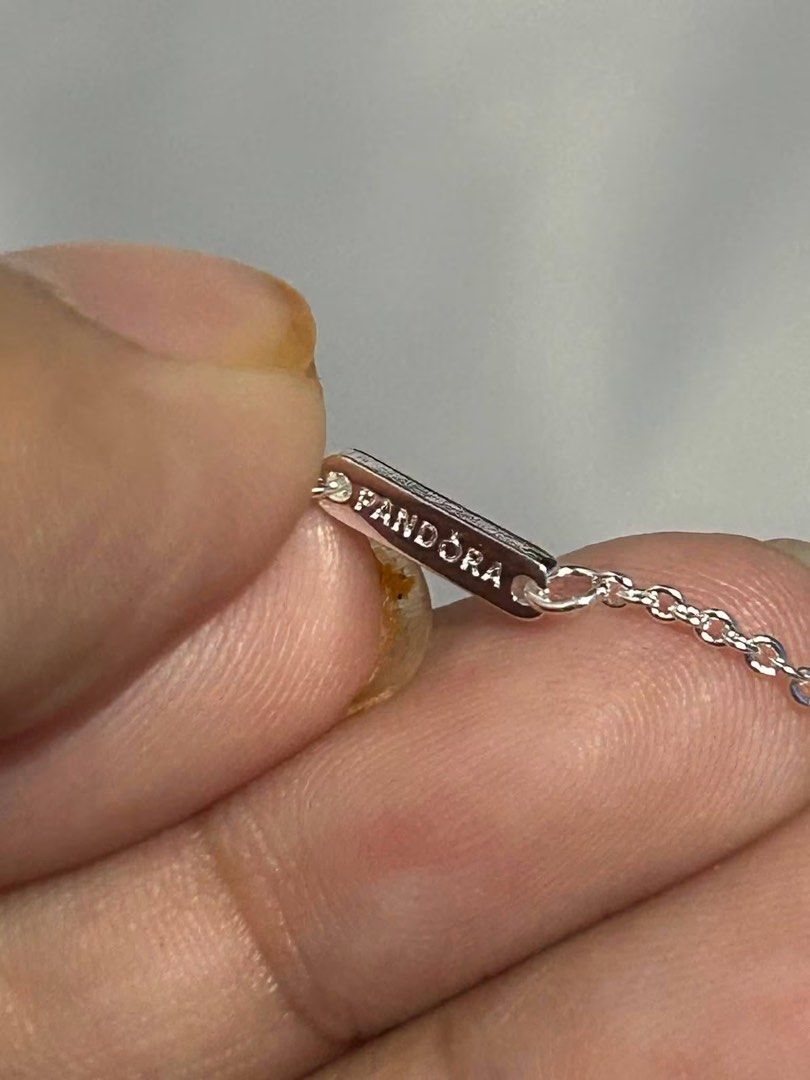 Pandora Sterling Silver Double Heart Necklace (Category: Necklaces) located in Baguio. Submitted by thrifty_cool (Listing ID 1444714735, Image 3). Description: - Pandora necklace - Sterling silver - Features two heart-shaped charms (one slightly smaller, layered) - Delicate chain - Clasp stamped with Pandora logo and '925 ALE' - NO BOX.