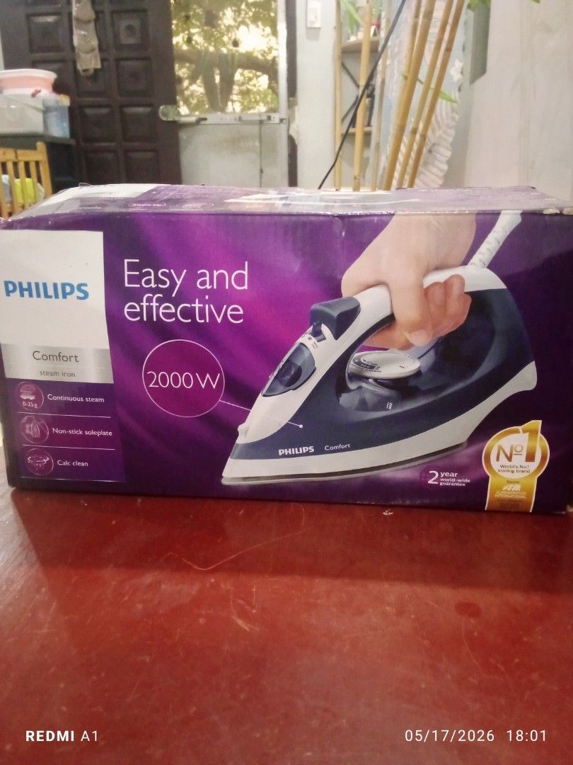 Philips Comfort GC420 Steam Iron 2000W (Category: Irons & Steamers) located in Bulacan. Submitted by _helpmedeclutterr (Listing ID 1444799237, Image 2). Description: - Philips Comfort Steam Iron - Powerful 2000W for quick heating - Calc-Clean system and Anti-Calc for long-lasting performance - 250ml water tank capacity - Drip Stop function to prevent stains - Comes with a water cup - Ideal for everyday ironing tasks.