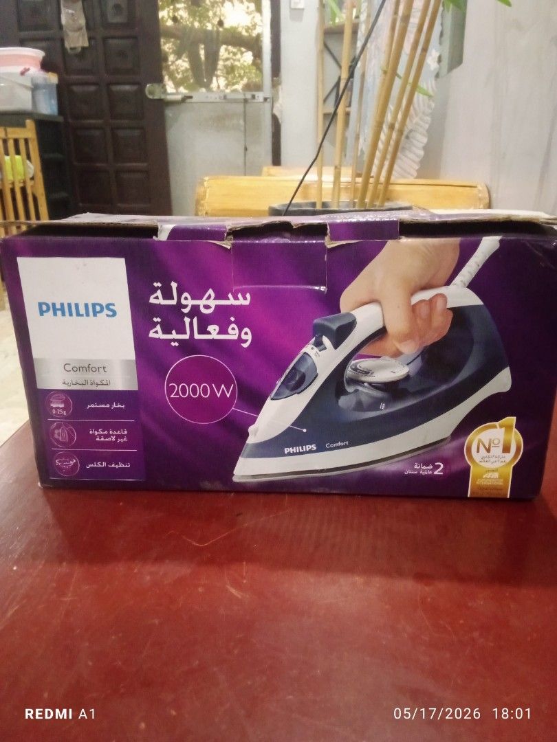 Philips Comfort GC420 Steam Iron 2000W (Category: Irons & Steamers) located in Bulacan. Submitted by _helpmedeclutterr (Listing ID 1444799237, Image 3). Description: - Philips Comfort Steam Iron - Powerful 2000W for quick heating - Calc-Clean system and Anti-Calc for long-lasting performance - 250ml water tank capacity - Drip Stop function to prevent stains - Comes with a water cup - Ideal for everyday ironing tasks.