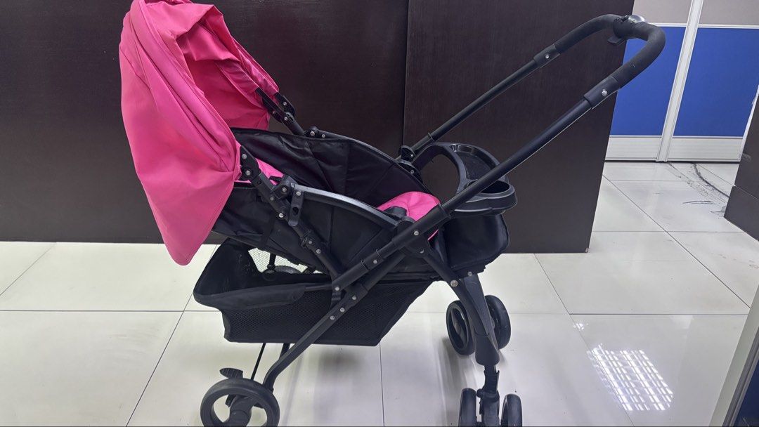 Picolo Reversible Stroller with Food Tray (Category: Strollers) located in Quezon City. Submitted by mommyclutter (Listing ID 1444856789, Image 2). Description: In excellent used condition Reversible Black and Pink.