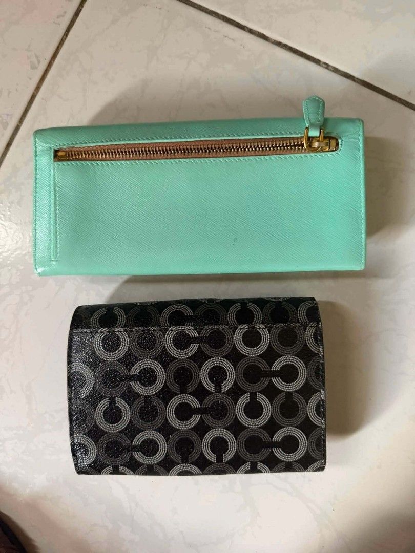 Prada & Coach Wallets Bundle (Category: Luxury Bags & Wallets) located in Bulacan. Submitted by alfredcarp0905 (Listing ID 1444680495, Image 2). Description: - Pre-loved Prada wallet: Mint green with a charming pink bow detail. - Pre-loved Coach wallet: Classic black and grey monogram design. - Both wallets offer multiple card slots and compartments. - Perfect for keeping your essentials neatly organized. ps:no flaws nor issue rfs:pandagdag pamab