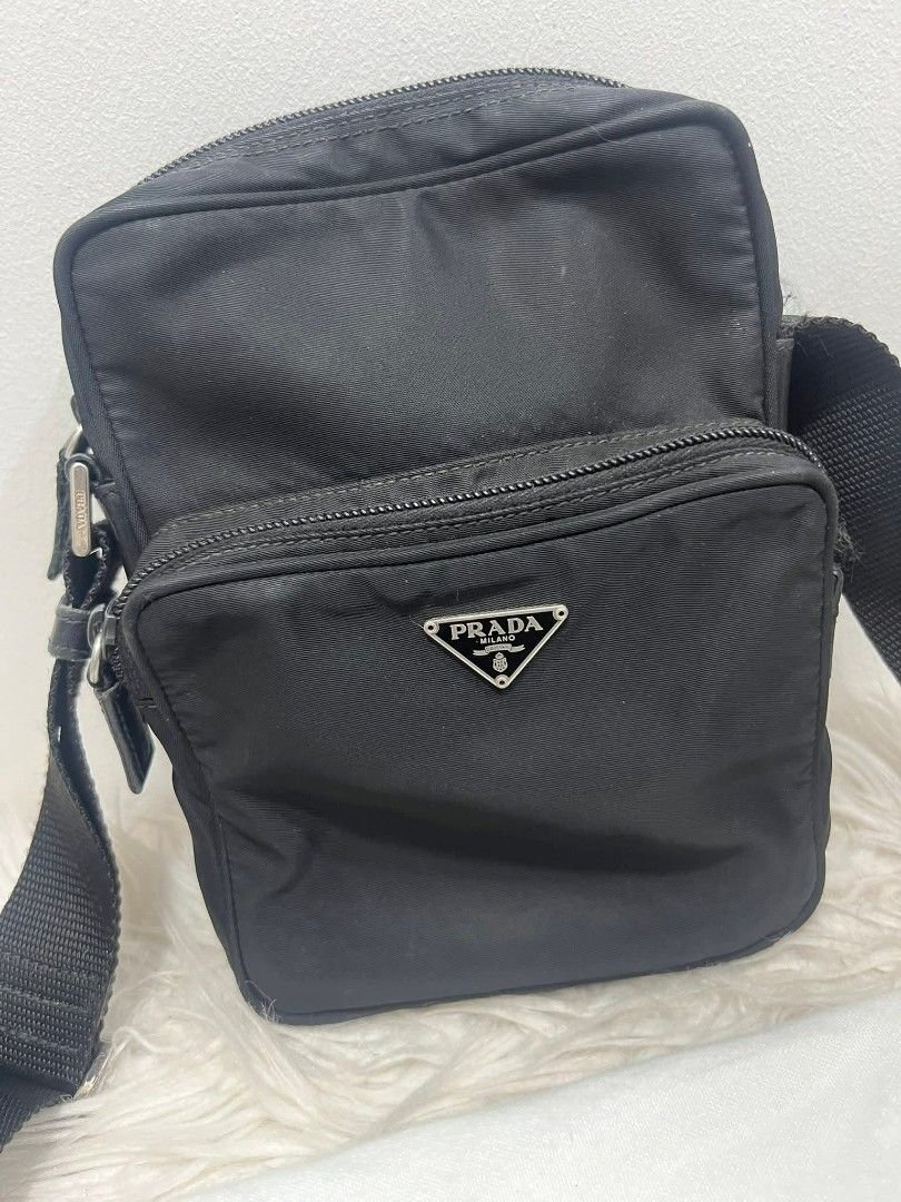 Prada Nylon Crossbody Bag Black (Category: Luxury Bags & Wallets) located in Bayugan. Submitted by daniel2019 (Listing ID 1444812694, Image 3). Description: - Authentic Prada crossbody bag - Black nylon material - Front zip pocket - Main zip compartment - Adjustable strap - Comes with dust bag - Ideal for daily use.
