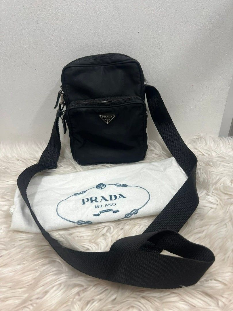 Prada Nylon Crossbody Bag Black (Category: Luxury Bags & Wallets) located in Bayugan. Submitted by daniel2019 (Listing ID 1444812694, Image 1). Description: - Authentic Prada crossbody bag - Black nylon material - Front zip pocket - Main zip compartment - Adjustable strap - Comes with dust bag - Ideal for daily use.