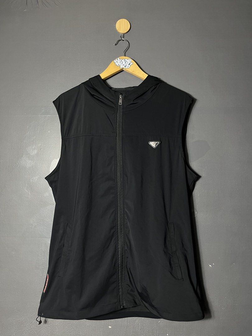 Prada Re-Nylon hooded vest (Category: Vests) located in Bacolod City. Submitted by piquedup.ph_v2 (Listing ID 1444849066, Image 1). Description: Prada Re-Nylon hooded vest Size: L | 22x28.5 Condition: Excellent Color rate: 9/10 (Color may vary to lighting) Flaws: None.