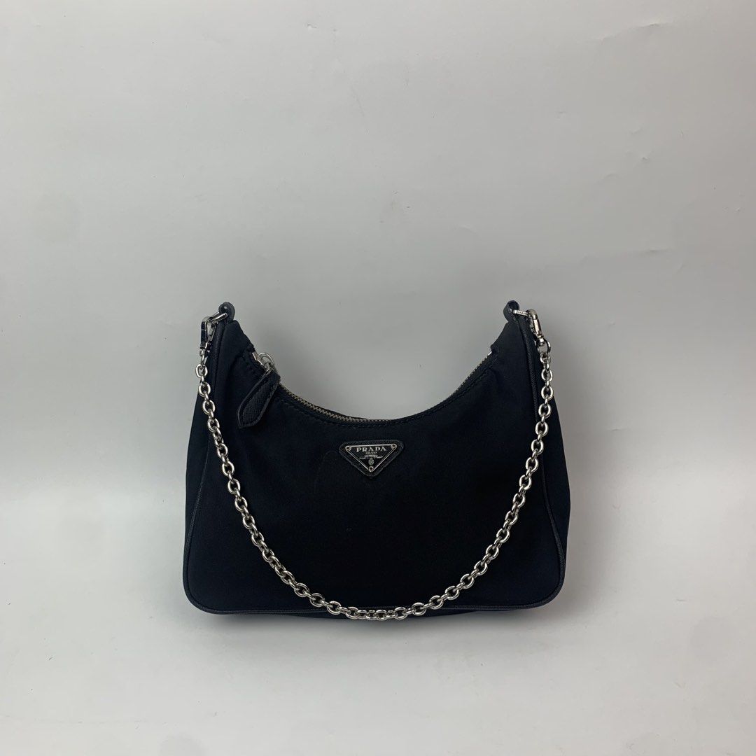 Prada Tessuto Nylon Mini Re-Edition Shoulder Bag Black (Category: Luxury Bags & Wallets) located in Cebu City. Submitted by devourapparel.ph (Listing ID 1444804503, Image 1). Description: WTS! Prada Tessuto Nylon Mini Re-Edition Shoulder Bag Black - Width: 9 inches - Length: 5 inches - Color rate: 9.7/10 - Very good condition - Issue: side seam unraveling ( see last pic ) - Still looks good in the outside Price: 1,800.