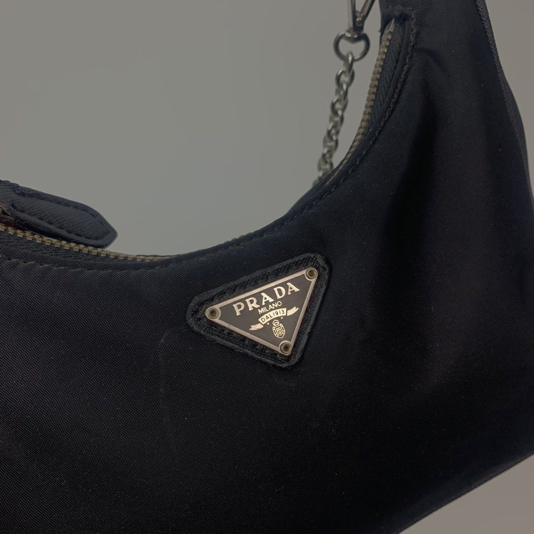 Prada Tessuto Nylon Mini Re-Edition Shoulder Bag Black (Category: Luxury Bags & Wallets) located in Cebu City. Submitted by devourapparel.ph (Listing ID 1444804503, Image 2). Description: WTS! Prada Tessuto Nylon Mini Re-Edition Shoulder Bag Black - Width: 9 inches - Length: 5 inches - Color rate: 9.7/10 - Very good condition - Issue: side seam unraveling ( see last pic ) - Still looks good in the outside Price: 1,800.