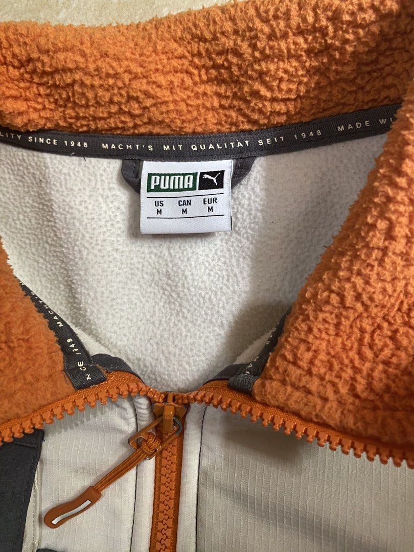 PUMA XTG Trail Woven FZ Jacket (Category: Coats, Jackets and Outerwear) located in Manila. Submitted by grndw.ez (Listing ID 1444811959, Image 3). Description: grey fleece body, orange accents, and a white top panel.