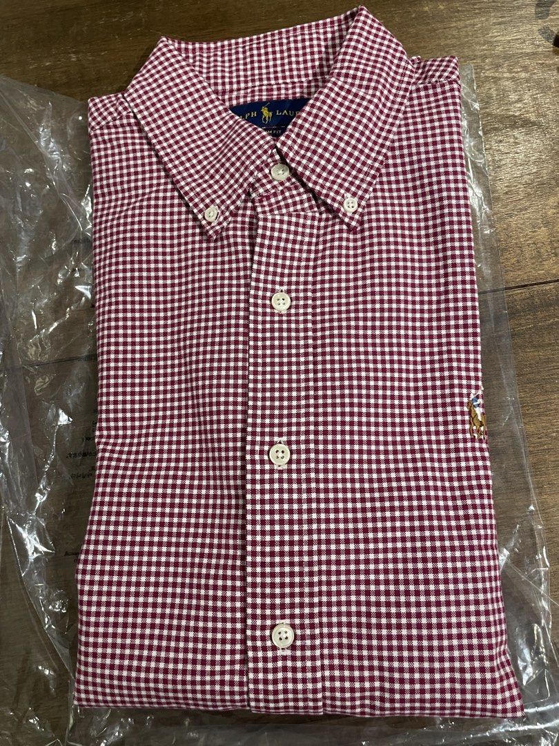 Ralph Lauren short-sleeve button-down shirt (Category: Tshirts & Polo Shirts ) located in Angeles City. Submitted by binostuff (Listing ID 1444788292, Image 2). Description: Ralph Lauren red gingham short-sleeve button-down shirt Size: M/M, Slim Fit Condition: Brand new, factory-bought 100% authentic. Classic red and white checkered design with button-down collar and embroidered pony logo..