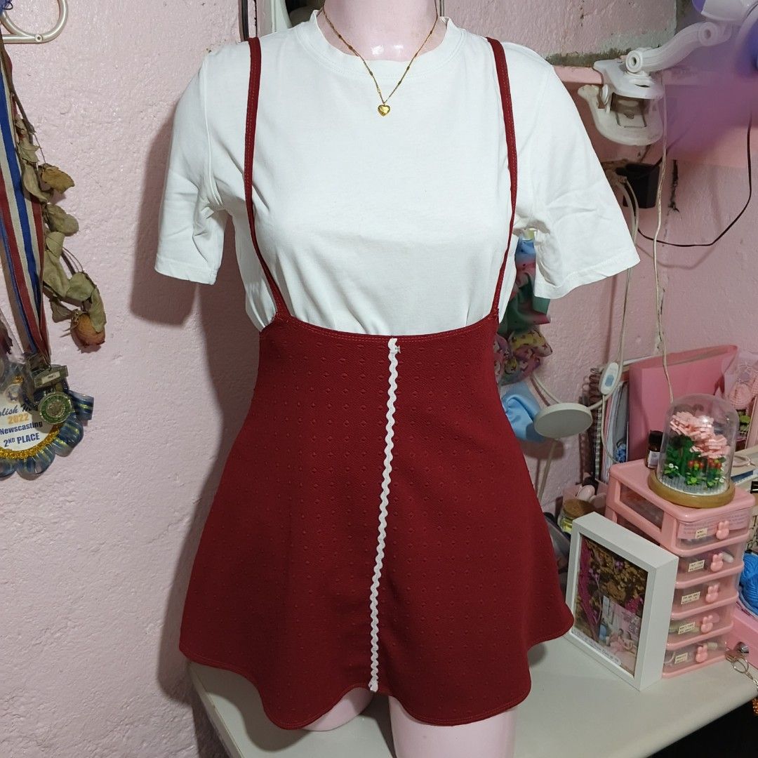 Red Suspender Dress with White Trim (Category: Dresses) located in Quezon City. Submitted by ysaai (Listing ID 1444688318, Image 3). Description: - note: Shirt not included, for photos only - Adorable red suspender dress - Textured fabric with a subtle dot pattern - Features white zigzag trim down the front - Straps cross elegantly at the back - Perfect for layering over a white tee for a fun, casual look - Easy to wear and style ‎📍 Location: Qu