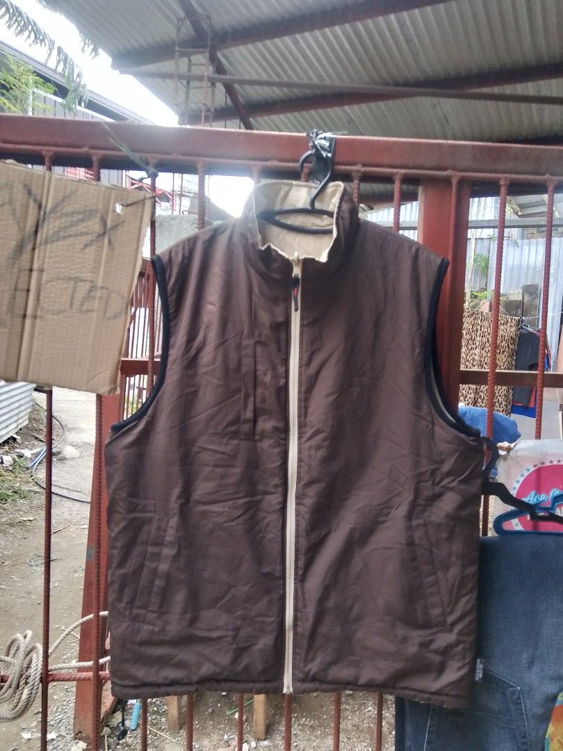 Reversible Puffer Vest - Beige and Brown (Category: Vests) located in Davao. Submitted by lentoythrift (Listing ID 1444810381, Image 3). Description: Two-in-one vest. Wear it beige or brown. Has a zipper closure and two zip pockets on the beige side. Sleeveless design, great for layering. Good for cooler weather. Check photos for details..
