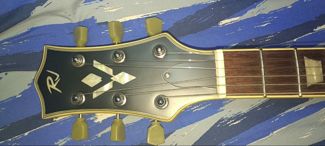 RJ Electric Guitar with Gig Bag (Category: Musical Instruments) located in Quezon City. Submitted by gastuserongungas82 (Listing ID 1444849582, Image 3). Description: Model: Blues breaker ( Special Edition ) Color: Vintage Little Dove RFS: Not using anymore. We need more space and funds of course (PRICE NEGOTIABLE FOR SURE BUYERS) Test till you drop. Already set up with elixir strings.