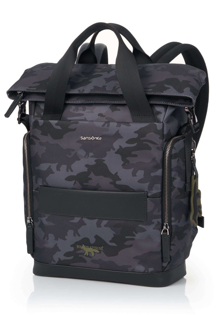 Samsonite x Maison Kitsuné Camo Roll Top Backpack (Category: Backpacks) located in Marikina City. Submitted by thejason (Listing ID 1444696030, Image 1). Description: - Stylish camo print backpack from Samsonite and Maison Kitsuné. - Versatile roll-top design for adjustable capacity. - Features both top handles and comfortable backpack straps. - Multiple convenient zip pockets on the front. - Adorable fox charm included. - Ideal for everyday use 