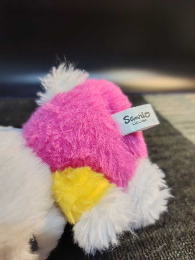 Sanrio Hello Kitty Plush Toy with Pink Bow (Category: Plushies & Soft Toys) located in Baguio. Submitted by 26_zerozero (Listing ID 1444837603, Image 2). Description: - Adorable Kitty plush toy - Classic white fur with a vibrant pink bow - Dressed in a charming pink and yellow outfit - Compact size, ideal for desks, shelves, or as a thoughtful gift - Authentic Sanrio licensed product.