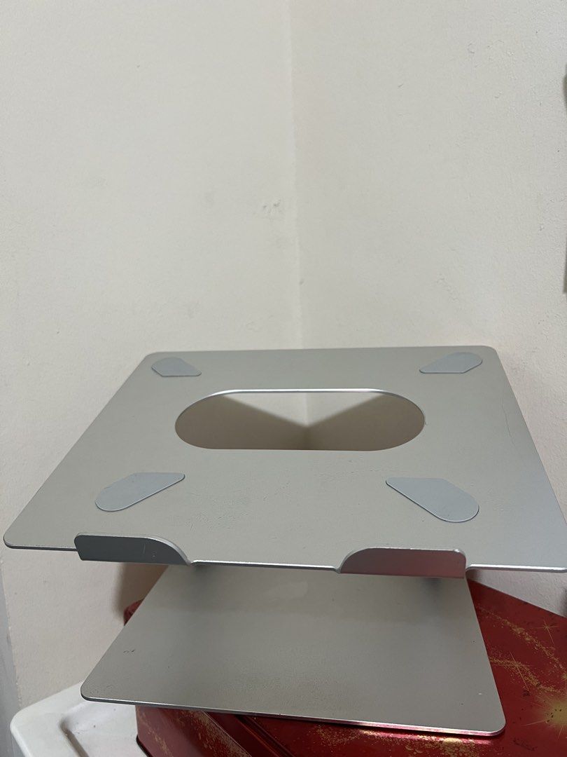 Silver Aluminum Laptop Stand (Category: Laptop Bags & Sleeves) located in Manila. Submitted by chiiiiing2 (Listing ID 1444734920, Image 2). Description: - Sleek, modern silver aluminum laptop stand. - Open cutout for enhanced ventilation. - Non-slip rubber pads to secure your laptop. - Sturdy construction for stability. - Ergonomic angle for comfortable working. - Promotes better airflow and reduces heat..