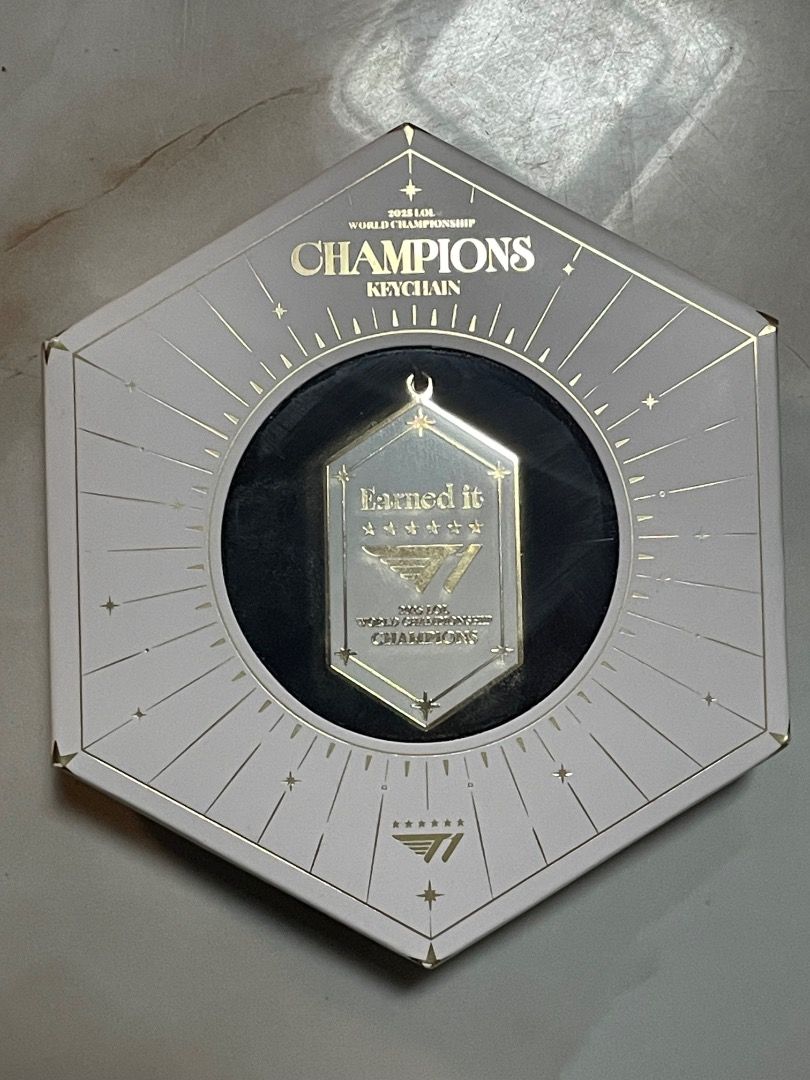 T1 2025 Champions Keychain (Official) (Category: Other Merchandise) located in Davao. Submitted by ellienki (Listing ID 1444784525, Image 1). Description: Bought for 1400 from shop-t1.gg Unused Official Merch.