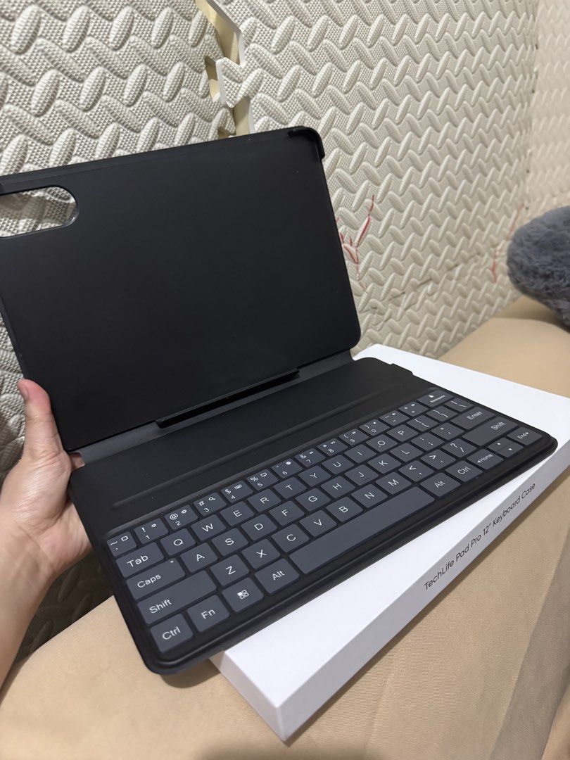 TechLife Pad Pro 12" Keyboard Case (Category: Cases & Sleeves) located in Mandaluyong City. Submitted by kendykeyn (Listing ID 1444758535, Image 2). Description: Brand new -opened lang to test the unit RFS: bought a case na pang kid since yung baby ko ang gagamit ng tablet 2pcs unsealed Php1,000.00 1pc sealed Php1,200.00 - TechLife keyboard case for 12" iPad Pro - Sleek black design - Adds full QWERTY keyboard functionality - Protects your tablet