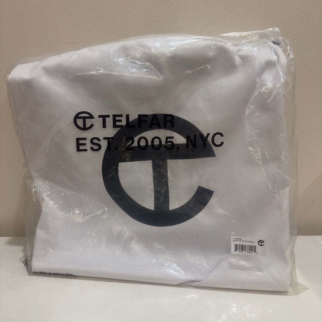 Telfar Medium Shopping Bag Dark Olive (Category: Luxury Bags & Wallets) located in Manila. Submitted by jmacg (Listing ID 1444780151, Image 2). Description: • Includes original packaging, dustbag, Telfar-branded velcro • Used only 5x • Est. Dimensions Height 11 1/4" Width 15" Depth 5" Strap Drop 21" Handle Drop 5 1/2" • Material: 50% Polyurethane, 50% Polyester • Shipping ℅ buyer.