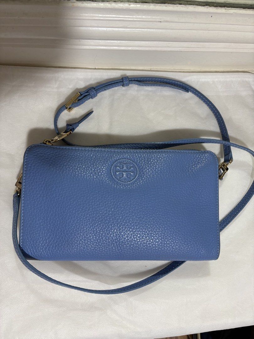 Authentic Tory Burch Crossbody Bag Light Blue Leather (Category: Luxury Bags & Wallets) located in Paranaque City. Submitted by happy_tanny (Listing ID 1444852696, Image 1). Description: - Authentic Light blue Tory Burch crossbody bag - Genuine pebbled leather - Elegant gold hardware - Adjustable strap for comfort - Compact size, fits all your essentials - Versatile for everyday or evening wear - Sourced from korea .