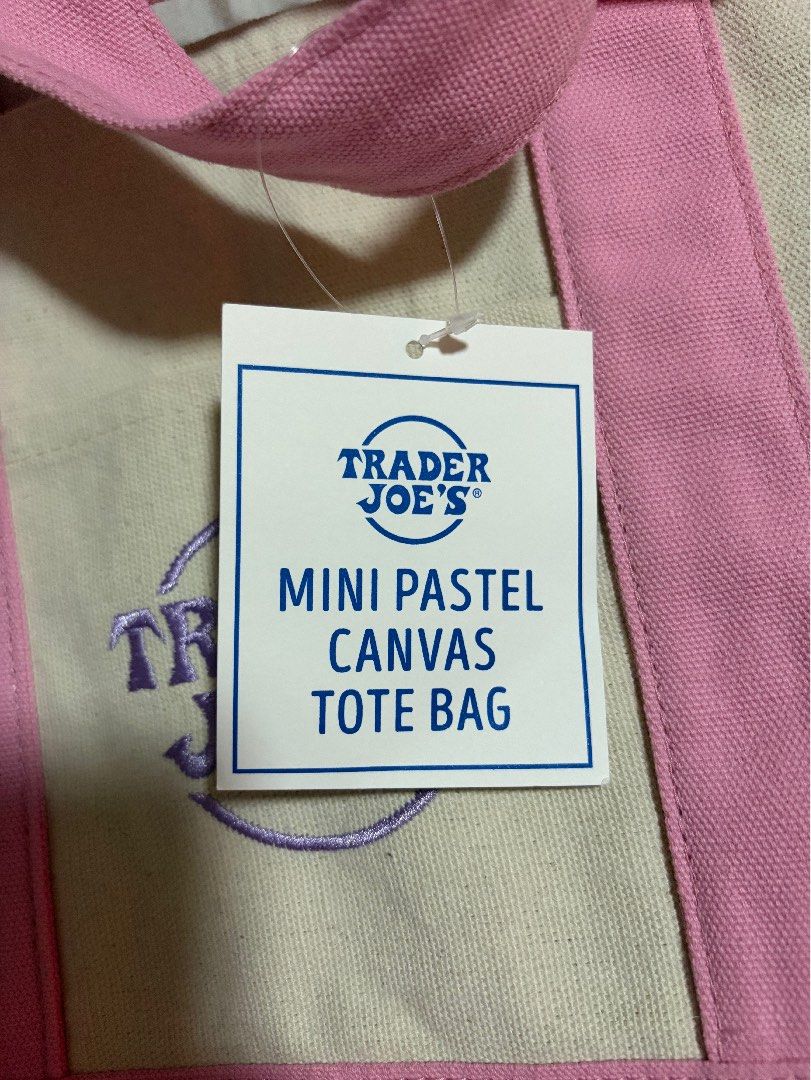 Trader Joe's Mini Pastel Canvas Tote Bag (Category: Tote Bags) located in Bulacan. Submitted by elehktrax (Listing ID 1444796794, Image 3). Description: - Cute mini tote bag from Trader Joe's - Pastel pink and cream canvas - Classic Trader Joe's logo embroidered on front - Ideal for small groceries or everyday essentials - Material: 65% Cotton, 35% Polyester - Product of Vietnam.