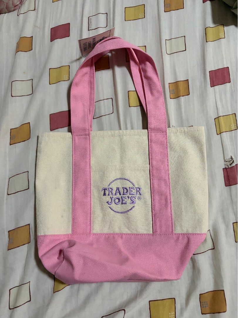 Trader Joe's Mini Pastel Canvas Tote Bag (Category: Tote Bags) located in Bulacan. Submitted by elehktrax (Listing ID 1444796794, Image 2). Description: - Cute mini tote bag from Trader Joe's - Pastel pink and cream canvas - Classic Trader Joe's logo embroidered on front - Ideal for small groceries or everyday essentials - Material: 65% Cotton, 35% Polyester - Product of Vietnam.