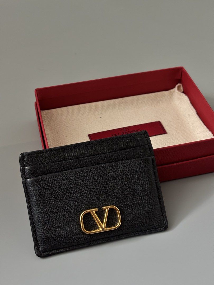 Valentino Card holder (Category: Luxury Bags & Wallets) located in Muntinlupa City. Submitted by closet.confessions (Listing ID 1444702169, Image 2). Description: Small in size, big on style. 🖤 VALENTlN0 Card Holder rank SA comes Fullset; box & dustbag, no receipt #valentino #valentinowallet #slg #valentinocardholder #valentinoph.