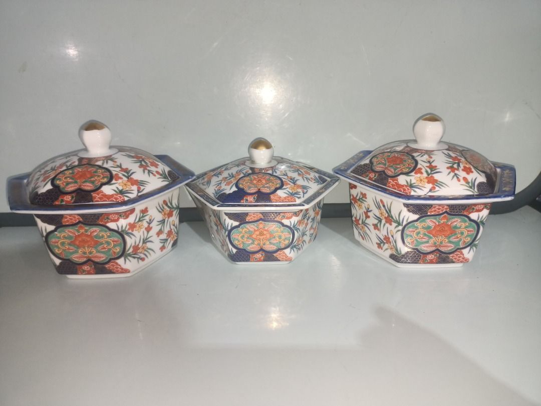 Vintage Imari Trinket Large Size (Category: Dinnerware & Cutlery) located in Munoz. Submitted by larryc1212 (Listing ID 1444822497, Image 3). Description: Vintage Imari Trinket Large Size - 2 Pieces available, P599 each - Each bowl comes with a matching lid - Lids feature elegant gold knobs - Beautiful floral pattern in orange, blue, and green - Largest bowl measures approximately 7 inches across - Ideal for serving snacks or side dishes - Unique