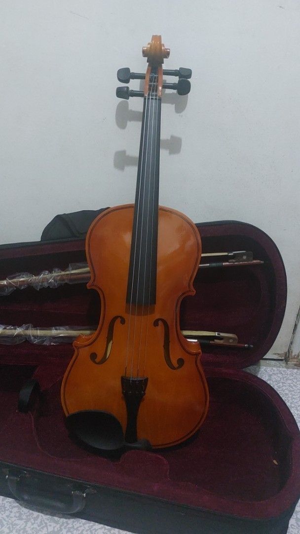 Viola with Case and Bows (Category: Musical Instruments) located in Makati City. Submitted by ghatchie (Listing ID 1444764632, Image 1). Description: - Beautiful wood finish viola - Black tuners - Perfect for beginners and intermediate players - Comes with a case (dark red interior) - Includes two bows - Ready to play.
