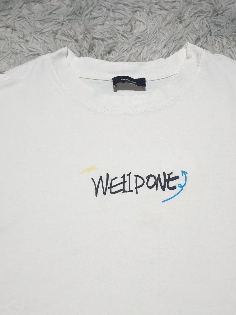 WELLDONE Graphic T-Shirt White (Category: Tshirts & Polo Shirts ) located in Abulug. Submitted by humanwhosellthings (Listing ID 1444821182, Image 3). Description: W È 1 1 D O N È ✅️Size: Large ✅️Dimensions: 22W x 26L ✅Condition: Excellent ✅Issue: Minimal hairline sa back print ✅Color Rate: 9.8/10.