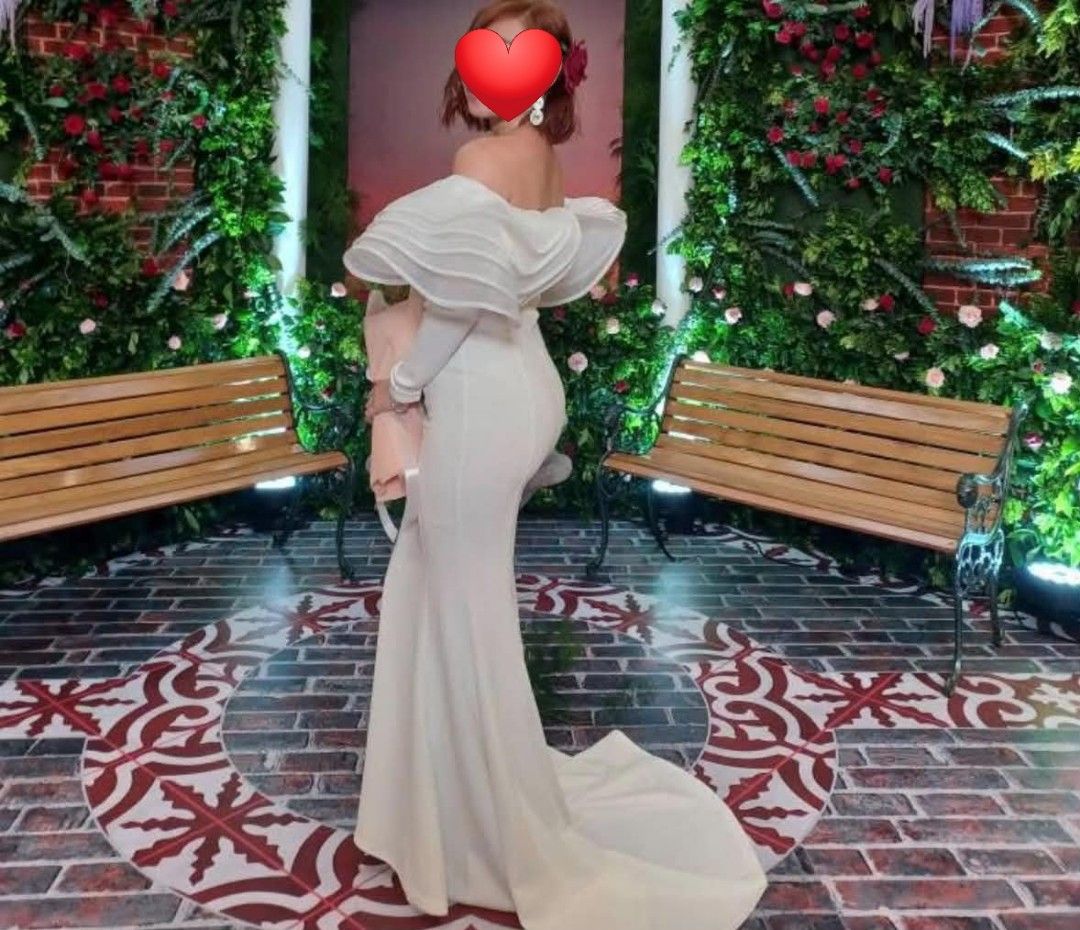 White Off-Shoulder Ruffle Mermaid Gown (Category: Evening dresses & gowns) located in Paranaque City. Submitted by yanyannriley (Listing ID 1444793571, Image 2). Description: - Elegant white mermaid gown - Dramatic off-shoulder ruffle detail - Long sleeves - Floor-length with a train - Fitted silhouette - Ideal for formal events or photoshoots - Worn only once, still in amazing condition -used once.