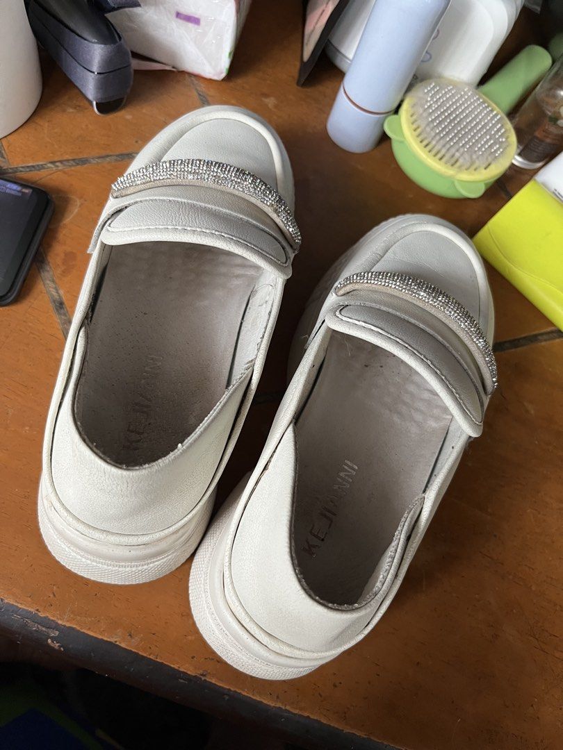 White Platform Loafers with Rhinestone Detail (Category: Loafers) located in Paranaque City. Submitted by tinnd (Listing ID 1444722031, Image 2). Description: - White platform loafers - Sparkly rhinestone strap across the front - Slip-on style - Brand: KEJIANNI (visible on insole) - Chunky sole for added height - Ideal for casual wear - Preloved manage expectation -need wash .
