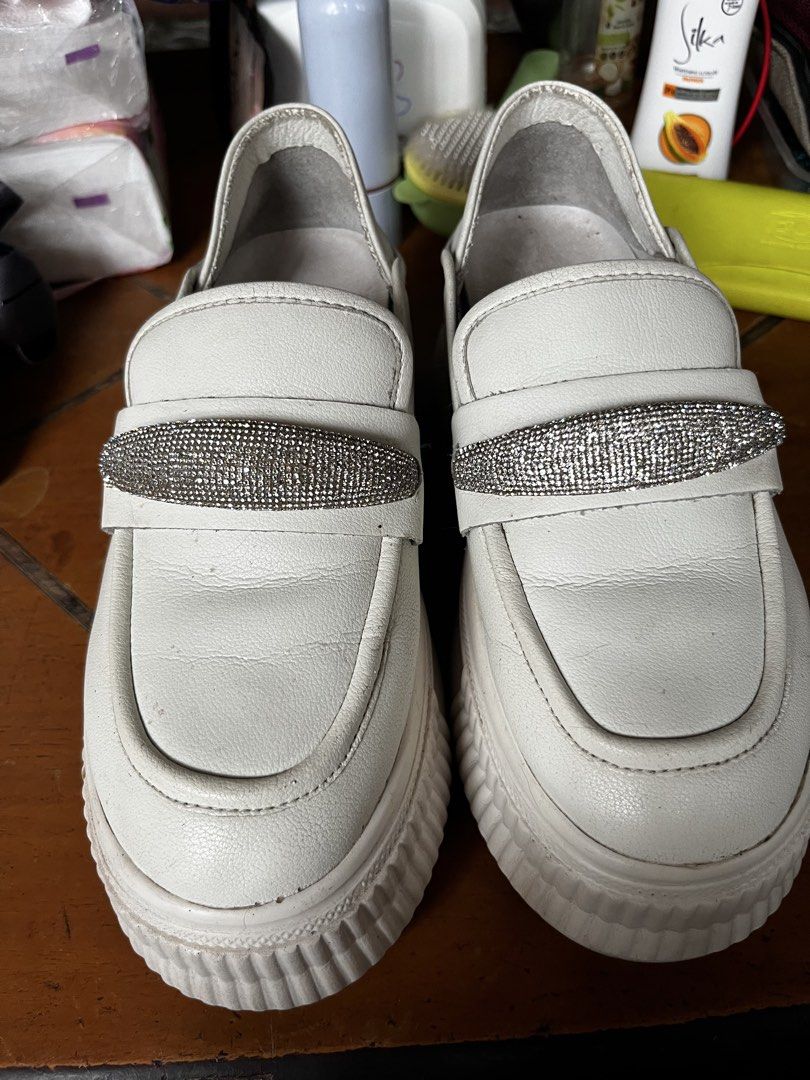 White Platform Loafers with Rhinestone Detail (Category: Loafers) located in Paranaque City. Submitted by tinnd (Listing ID 1444722031, Image 1). Description: - White platform loafers - Sparkly rhinestone strap across the front - Slip-on style - Brand: KEJIANNI (visible on insole) - Chunky sole for added height - Ideal for casual wear - Preloved manage expectation -need wash .