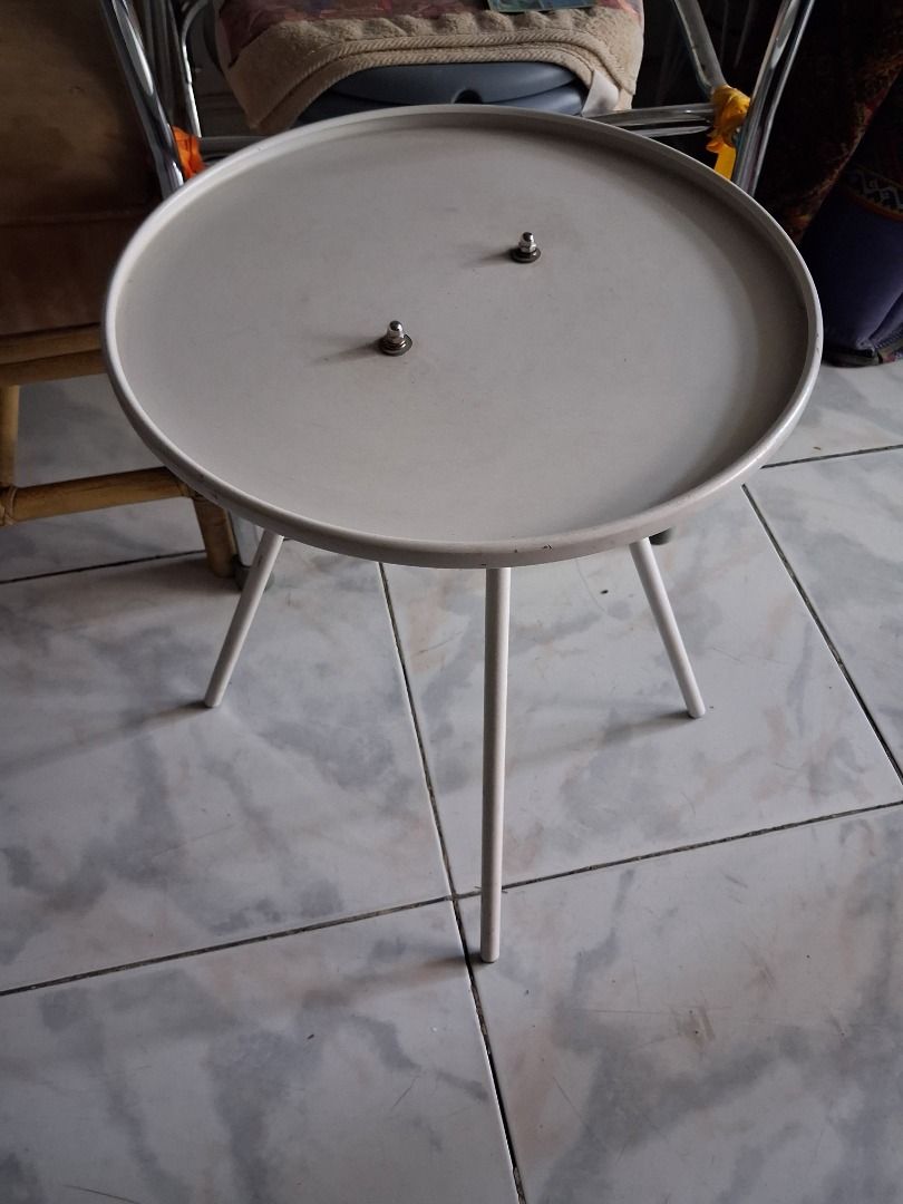 White Round Side Table with 3 Legs (Category: Tables & Sets) located in Quezon City. Submitted by glaclac (Listing ID 1444718463, Image 1). Description: - Simple white side table - Round tabletop - Two small metal knobs - Stands on three slender legs - Ideal for drinks, small lamps, or decorative items - Lightweight and easy to move - Suitable for any room in your home.