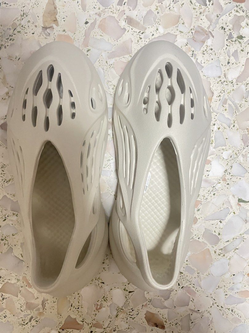 Yeezy Foam Runner Sandals (Category: Sandals) located in Singapore. Submitted by windowstosun (Listing ID 1444704551, Image 1). Description: - Authentic Yeezy Foam Runners - Colour: Light Beige / Off-White - Unique slip-on design - Breathable cutouts - Ideal for casual wear - Please refer to photos for exact shade and condition.