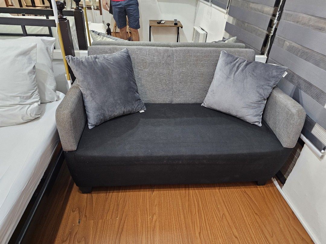2-Seater Sofa with Grey and Black Fabric (Category: Sofas) located in Makati City. Submitted by smith_1 (Listing ID 1441502911, Image 3). Description: - Stylish two-seater sofa - Grey backrest and arms - Black seat cushion - Low, sturdy legs - Ideal for small spaces, apartments, or studios.