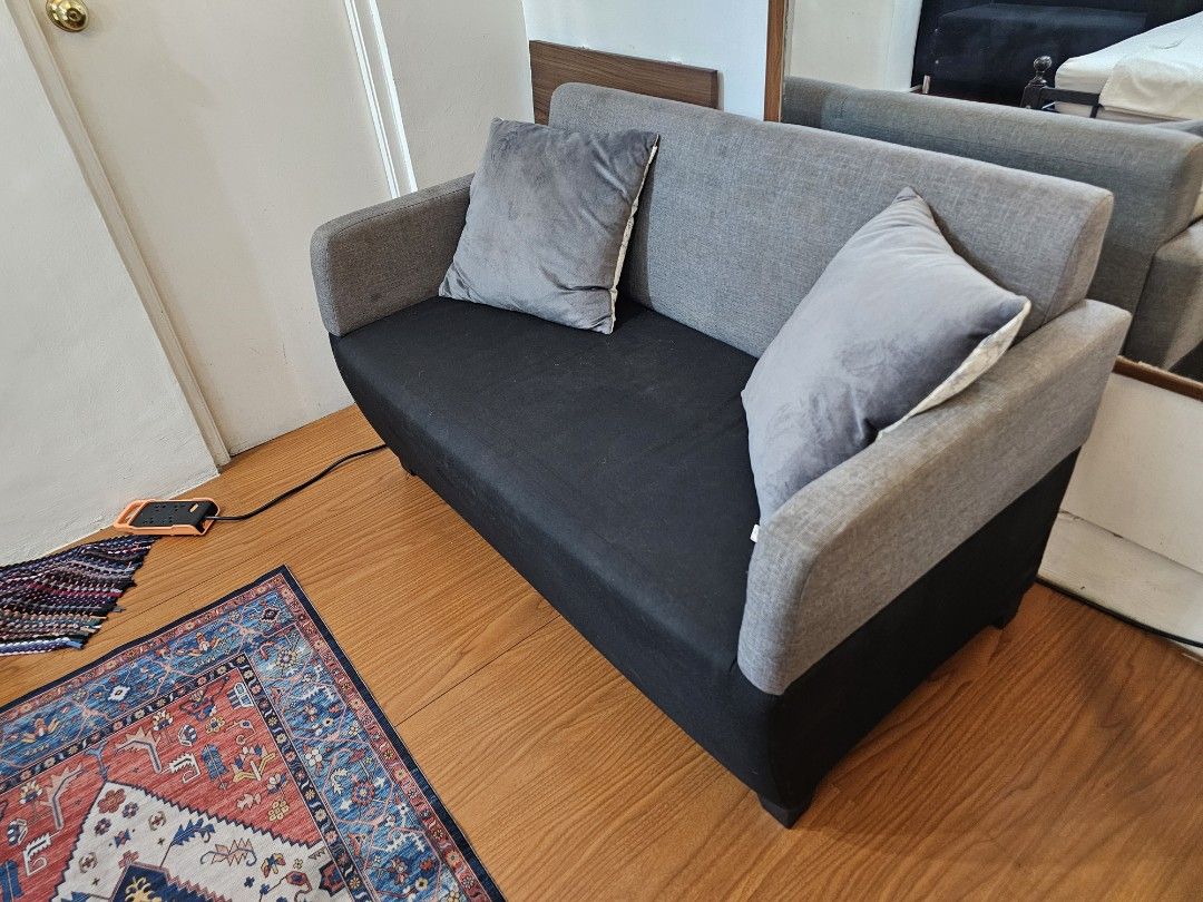 2-Seater Sofa with Grey and Black Fabric (Category: Sofas) located in Makati City. Submitted by smith_1 (Listing ID 1441502911, Image 1). Description: - Stylish two-seater sofa - Grey backrest and arms - Black seat cushion - Low, sturdy legs - Ideal for small spaces, apartments, or studios.