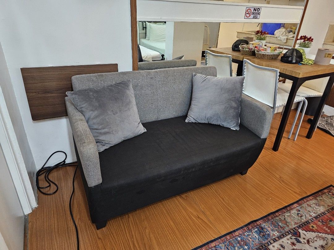 2-Seater Sofa with Grey and Black Fabric (Category: Sofas) located in Makati City. Submitted by smith_1 (Listing ID 1441502911, Image 2). Description: - Stylish two-seater sofa - Grey backrest and arms - Black seat cushion - Low, sturdy legs - Ideal for small spaces, apartments, or studios.