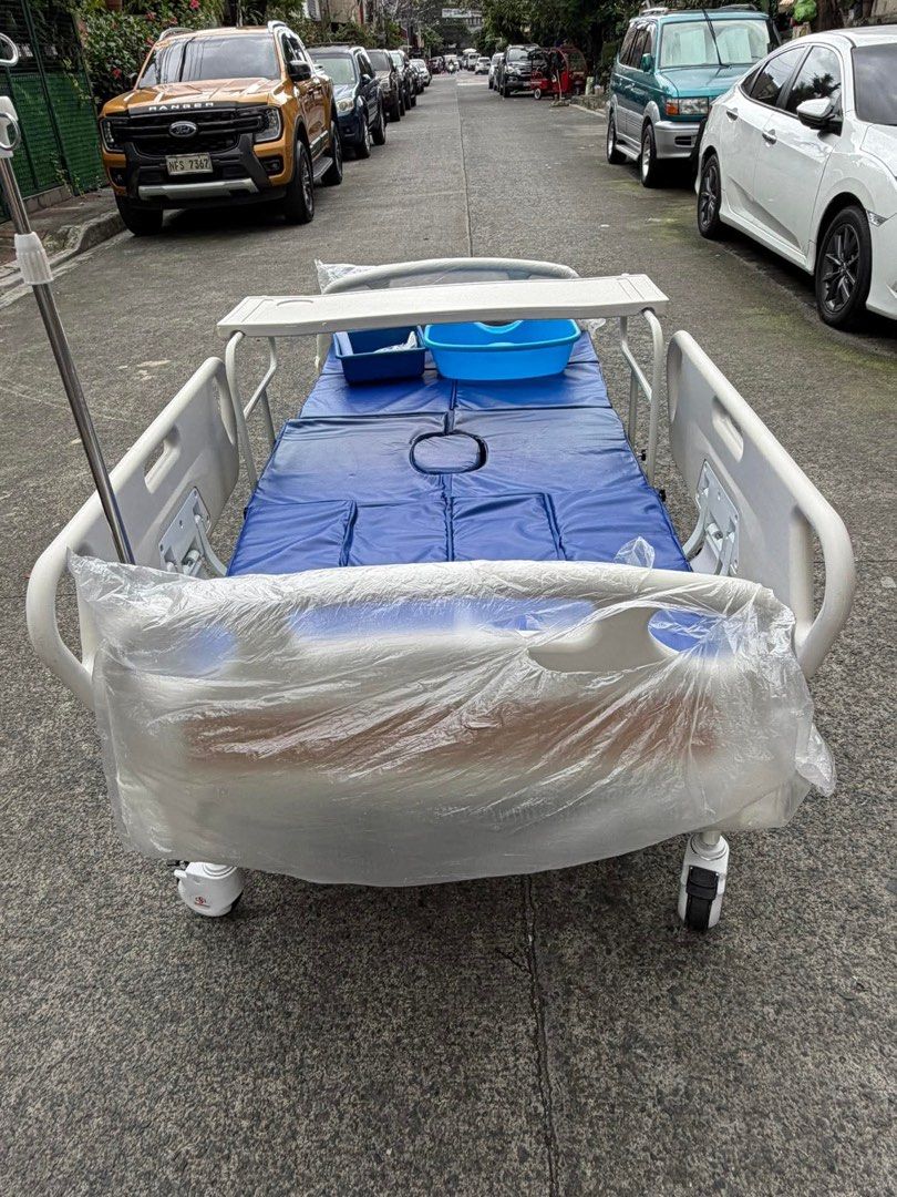 7Function Electric Bed (Category: Medical Supplies & Tools) located in Manila. Submitted by rosel2001 (Listing ID 1441446409, Image 2). Description: - Adjustable hospital bed for comfort and support. - Includes a comfortable mattress with a hygiene cutout. - Detachable tray for convenient meal times or activities. - Safety side rails for added security. - Wheels for easy maneuverability around the room. - Ready for immediate use..