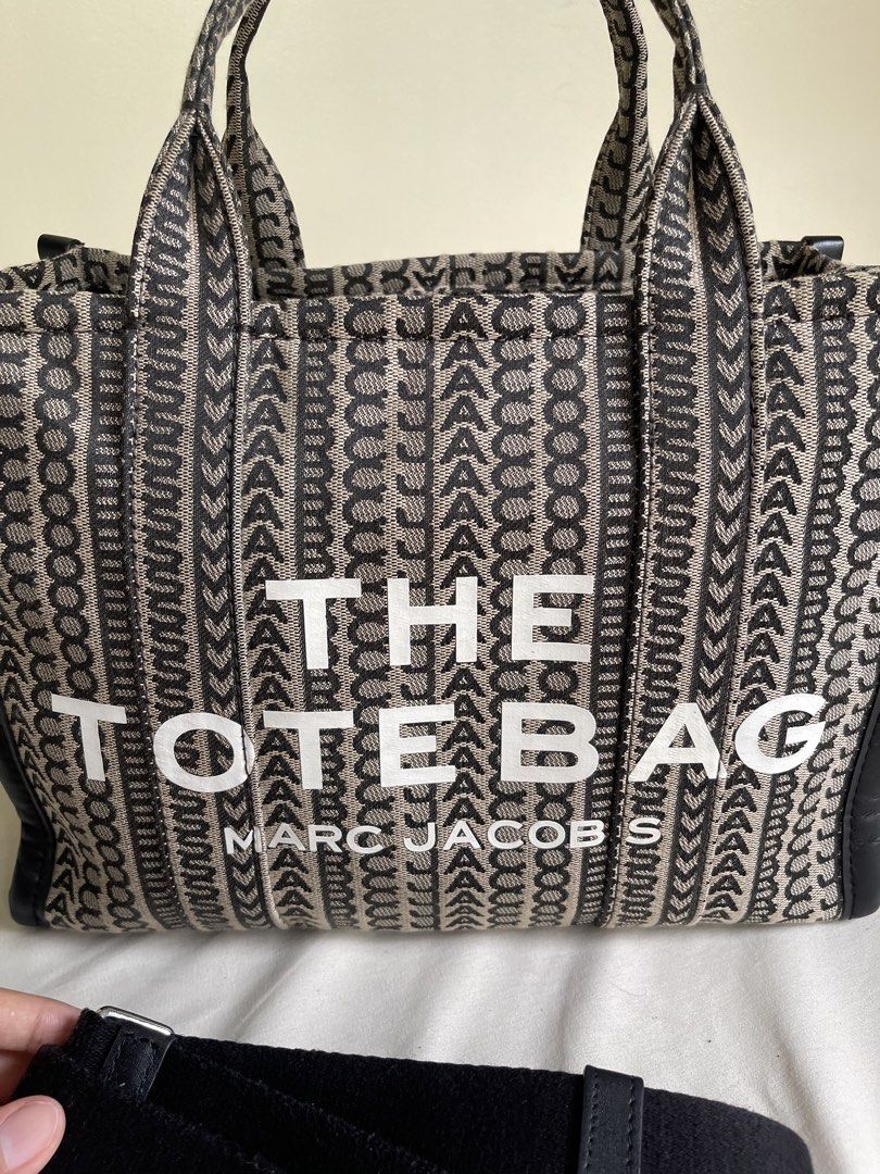 💯 Authentic Marc Jacobs The Tote Bag Medium in Jacquard Monogram (Category: Luxury Bags & Wallets) located in Makati City. Submitted by eucccuy (Listing ID 1441395566, Image 2). Description: Decluttering! 💯 Authentic Marc Jacobs The Tote Bag -Medium Size -with strap, care cards, and paper bag -lost dustbag Jacquard Monogram with Genuine Leather Trims Used mostly during travels only Bought locally at GB Price slightly nego DM for queries!.