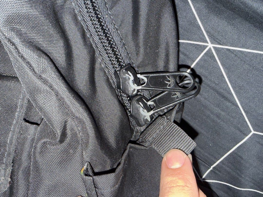 Adidas Black Backpack with Patches (Category: Backpacks) located in Manila. Submitted by 2c2qfftjdk21661 (Listing ID 1441519383, Image 2). Description: - Classic black Adidas backpack - Spacious main compartment with zipper closure - Convenient front pocket with velcro fastening - Two side pockets for extra storage - Features adorable Adidas patches on the front - Padded shoulder straps for maximum comfort - Ideal for everyday use, school, or cas