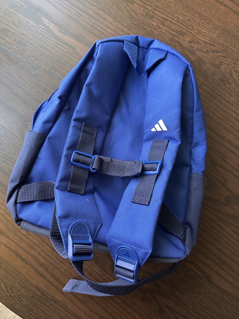 Adidas Logo Backpack - Blue (Category: Backpacks) located in Singapore. Submitted by happydeecee (Listing ID 1441400745, Image 2). Description: - Adidas Logo Backpack - Iconic white stripes on the side - Adidas logo on the front pocket - Main compartment for storage - Front zip pocket for essentials - Adjustable shoulder straps for comfort - Ideal for school or everyday use.