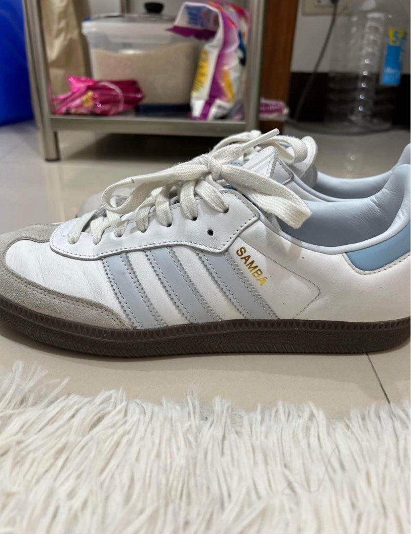 Adidas Samba White Light Blue Stripes Sneakers (Category: Sneakers) located in Manila. Submitted by hello_lilies (Listing ID 1441521541, Image 3). Description: - Classic Adidas Samba sneakers - White leather with iconic light blue stripes - Durable gum sole - Perfect for everyday style and a sneaker essential - Pre-loved with plenty of wear remaining.