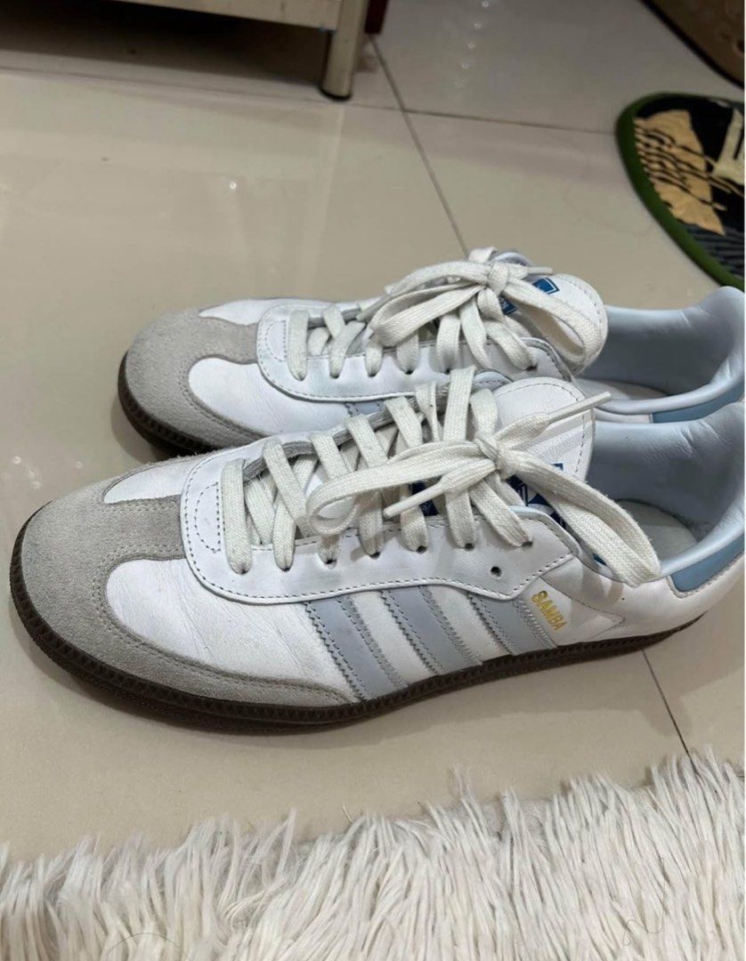Adidas Samba White Light Blue Stripes Sneakers (Category: Sneakers) located in Manila. Submitted by hello_lilies (Listing ID 1441521541, Image 2). Description: - Classic Adidas Samba sneakers - White leather with iconic light blue stripes - Durable gum sole - Perfect for everyday style and a sneaker essential - Pre-loved with plenty of wear remaining.