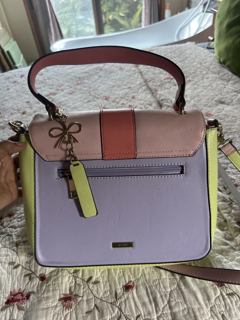 ALDO Colorblock Top Handle Bag with Shoulder Strap (Category: Shoulder Bags) located in Digos. Submitted by puremountain.6f1756 (Listing ID 1441425644, Image 3). Description: Note: please paki tingnan maigi mga pictures .. meron issues sa strap and malapit sa handle … bawal sa MAARTE and this is only Preloved - Adorable ALDO colorblock handbag - Pastel color palette: pink, lilac, and lime green - Versatile carrying options: top handle and detacha