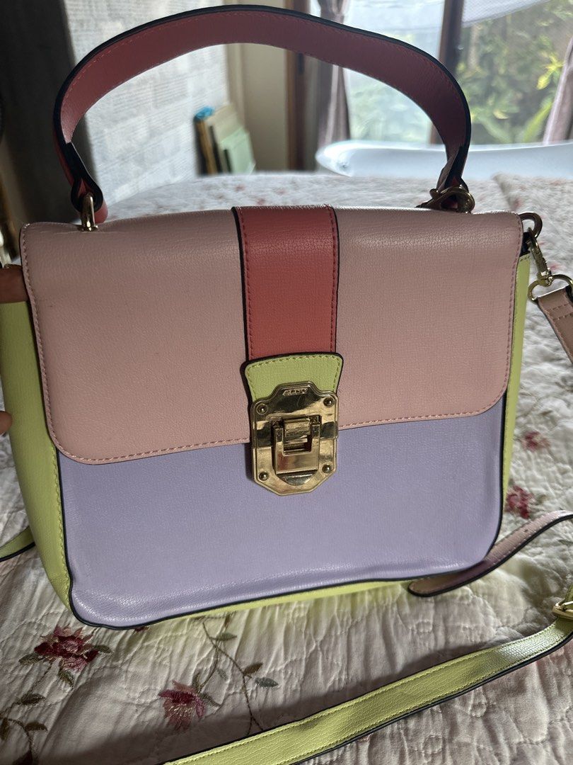 ALDO Colorblock Top Handle Bag with Shoulder Strap (Category: Shoulder Bags) located in Digos. Submitted by puremountain.6f1756 (Listing ID 1441425644, Image 1). Description: Note: please paki tingnan maigi mga pictures .. meron issues sa strap and malapit sa handle … bawal sa MAARTE and this is only Preloved - Adorable ALDO colorblock handbag - Pastel color palette: pink, lilac, and lime green - Versatile carrying options: top handle and detacha