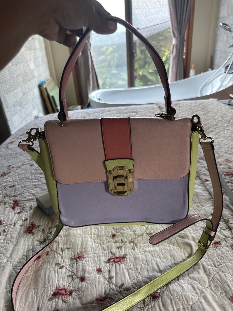 ALDO Colorblock Top Handle Bag with Shoulder Strap (Category: Shoulder Bags) located in Digos. Submitted by puremountain.6f1756 (Listing ID 1441425644, Image 2). Description: Note: please paki tingnan maigi mga pictures .. meron issues sa strap and malapit sa handle … bawal sa MAARTE and this is only Preloved - Adorable ALDO colorblock handbag - Pastel color palette: pink, lilac, and lime green - Versatile carrying options: top handle and detacha